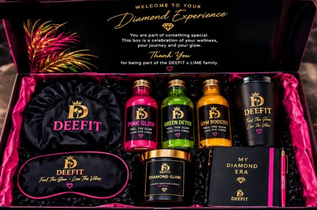 The open Diamond Edition box showing three mini juices, a tumbler, a satin bonnet, an eye mask, a candle and a journal