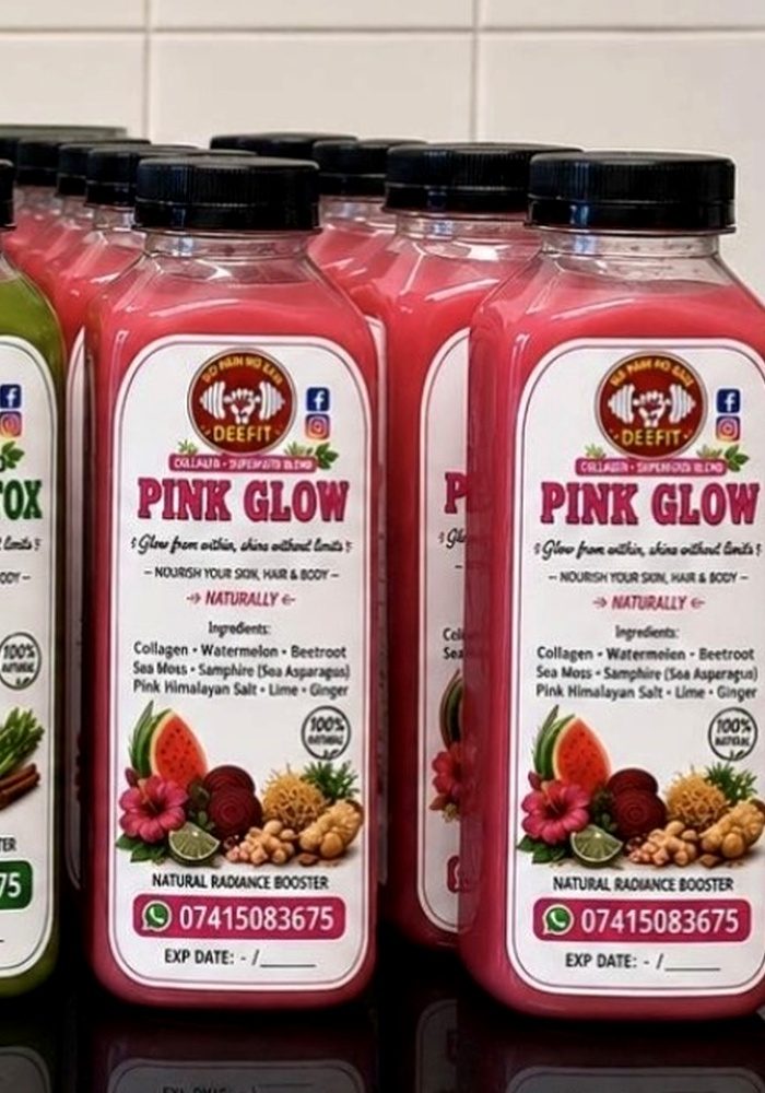 Bottles of DEEFIT Pink Glow, a pink watermelon, beetroot and dragon fruit juice